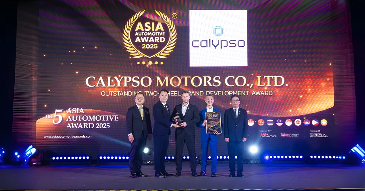Five representatives stand on stage as Calypso Motors receives the Outstanding Two-Wheel Brand Development Award at the 5th ASEAN Automotive Awards 2025, with company leaders and award officials in front of a large LED screen displaying the event and Calypso Motors logos.